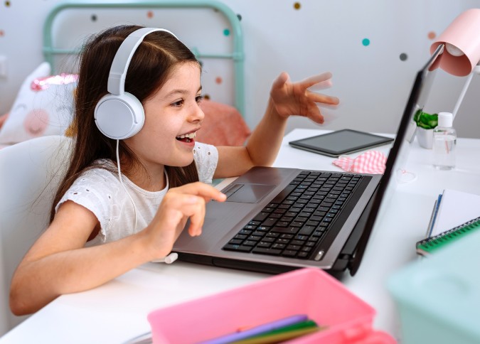 young girl attending virtual play therapy session